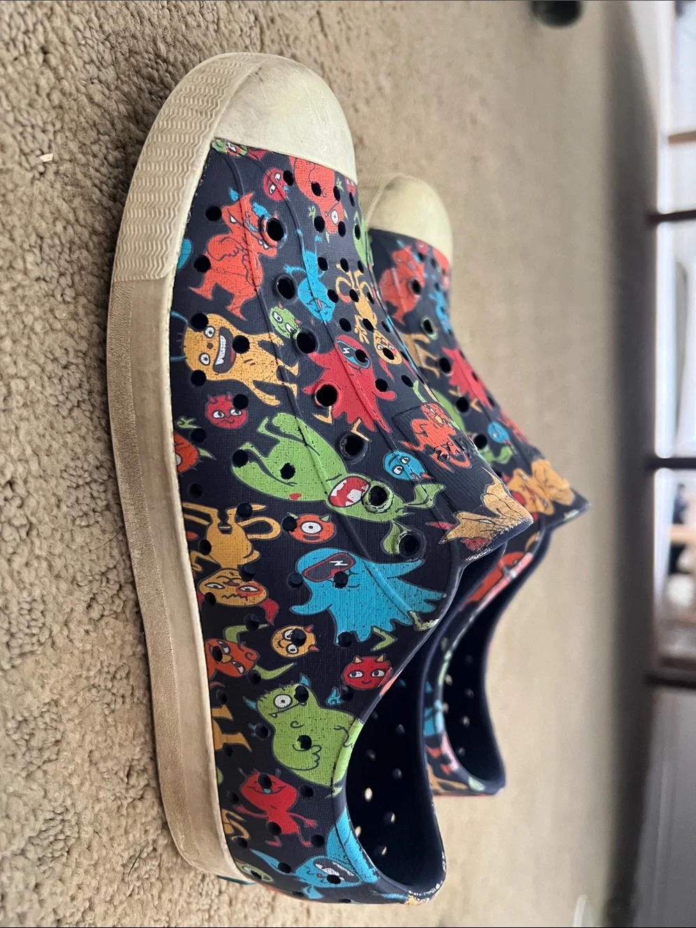 Native Kids Slip-On Shoes in Black with Multicolor Monster Print